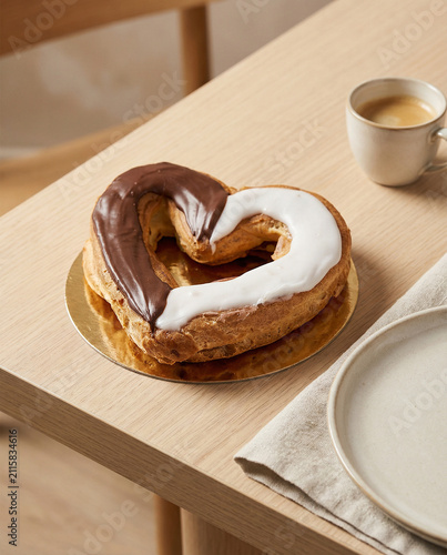 Chocolate and Vanilla Glazed Ring Pastry Served with Coffee
