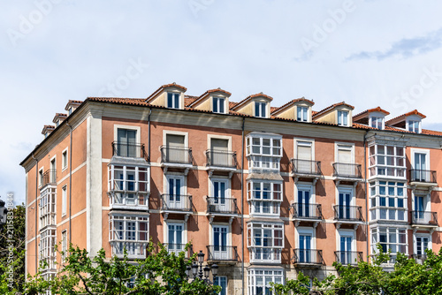 Old residential building facade in Santander, Spain, featuring balconies and dormer windows.