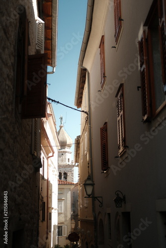 Historic old town street and traditional stone architecture in Krk town, Croatia