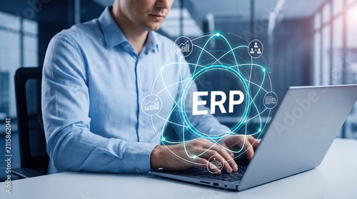 Businessman using ERP software on laptop. Professional managing enterprise resource planning.
