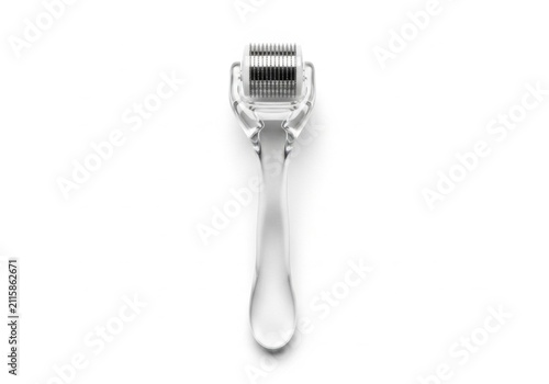Transparent derma roller for microneedling on white background