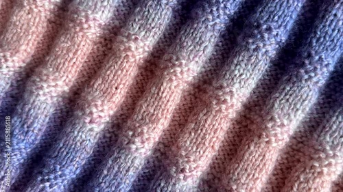 Multicoloured handmade knitted woollen woolen fabric background.