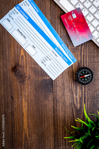 Obraz na płótnie planing trip with tickets, compass, credit card on wooden background top view sp