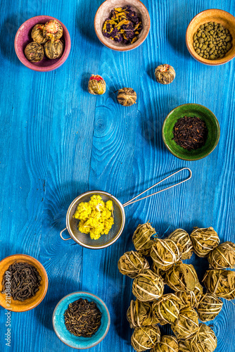 Quadro su tela Tea-party with different herbal tea on blue desk background flat lay mock up
