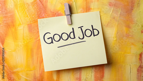 Handwritten motivational sticky note saying Good Job on colorful background. Positive reinforcement message for employee recognition and team appre...