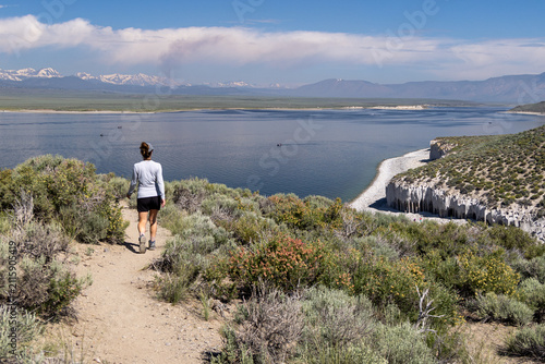 Fotografie Woman walking toward a scenic Crowley Lake overlook