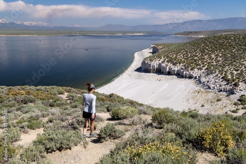 Obraz na plátně Woman overlooking Crowley Lake in California's Eastern Sierra