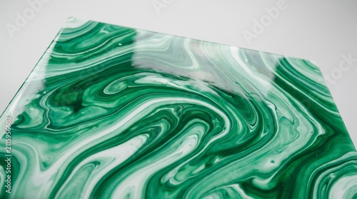 Green marble fluid ink swirl. Abstract liquid acrylic paint texture background.