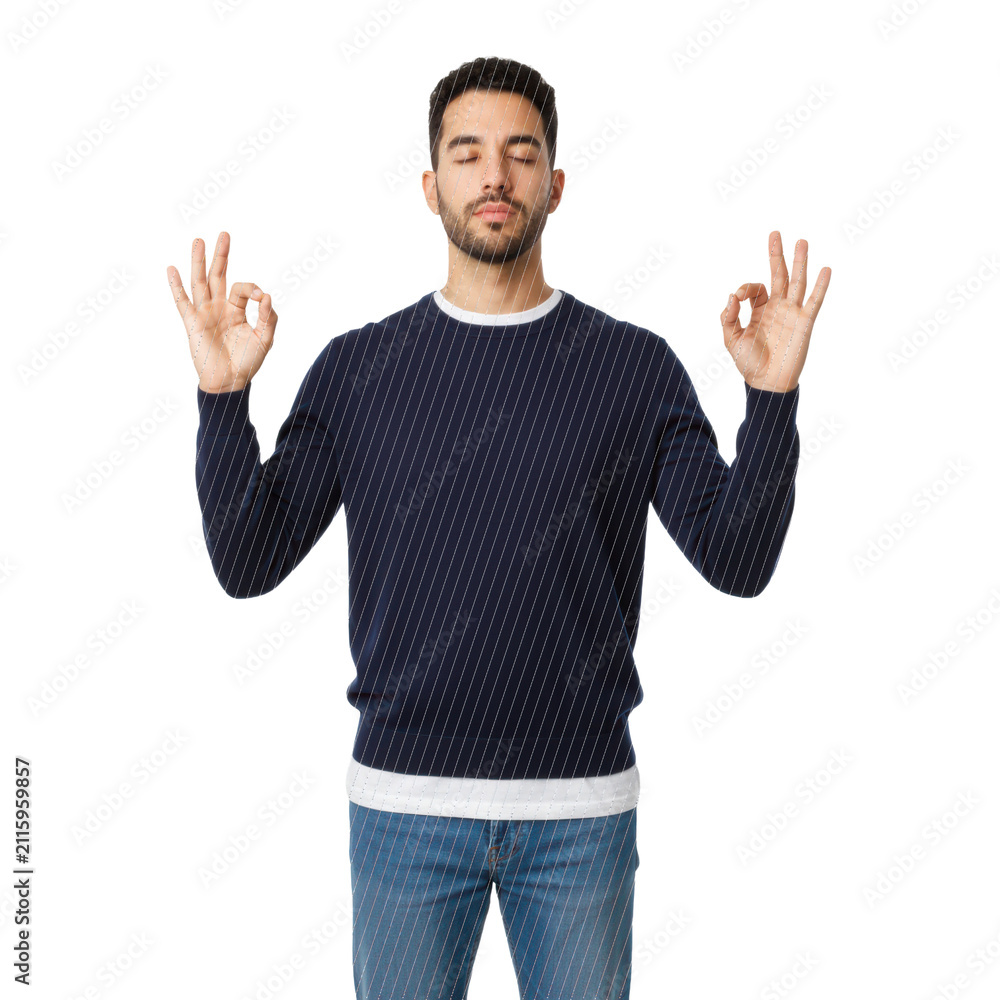 Naklejka premium Young hispanic man with dark curly hair and beard, wearing navy sweater and blue jeans, meditating with Gyan Mudra on a bright white studio background, deep inner peace atmosphere.