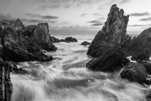 Incoming tide crashing into rocks