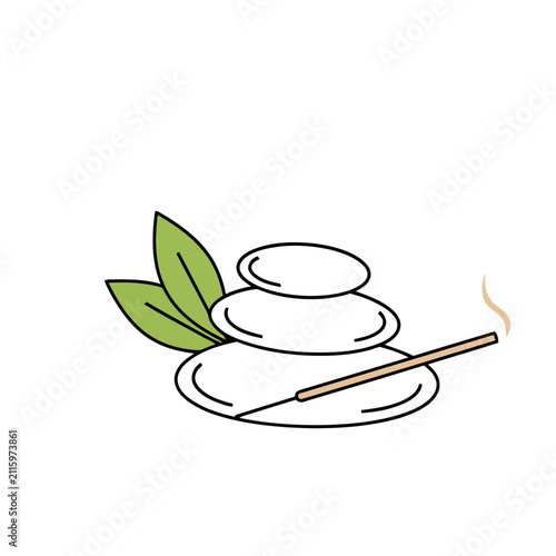 Stack of stones with incense and leaves