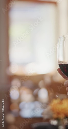 People, hands and red wine with cheers in restaurant for romantic dinner, date or fine dining. Glasses, man and woman with toast or love in diner for romance, celebration or anniversary together