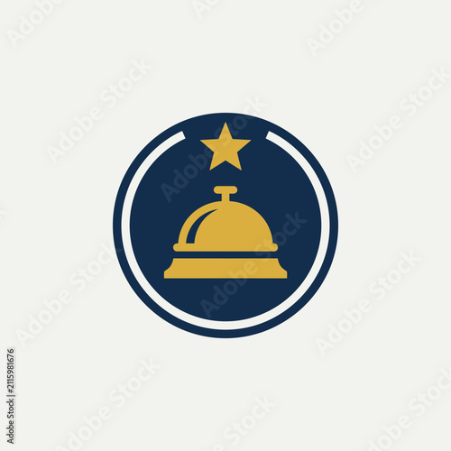 Golden bell with a star on top.