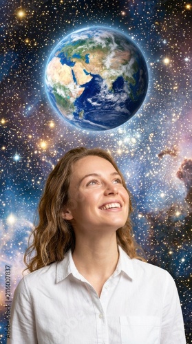 Woman looking at planet Earth in space. Female dreamer observing global galaxy universe.