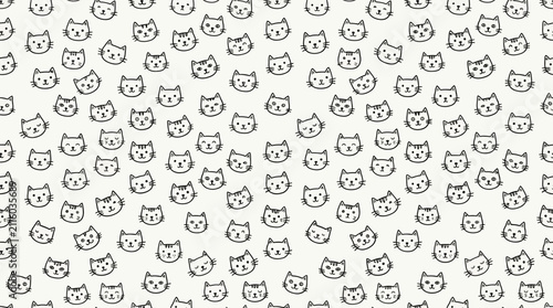 A repeating pattern of cute, hand-drawn cartoon cat faces with various expressions on a light background, creating a whimsical and playful design.