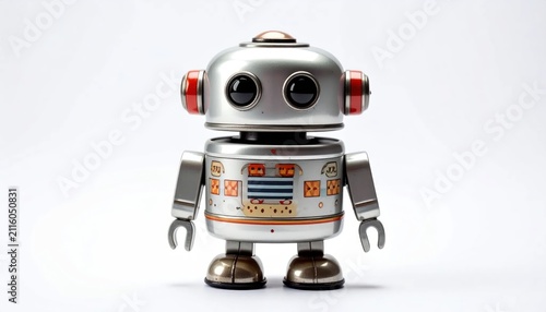 Small silver retro toy robot on white background