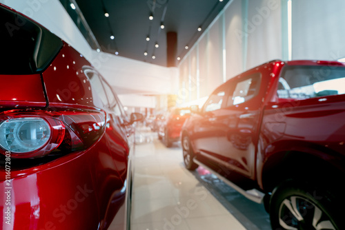 Foto Modern automobile dealership showroom with new vehicle on display for automotive retail, consumer purchasing, vehicle financing and transportation industry business
