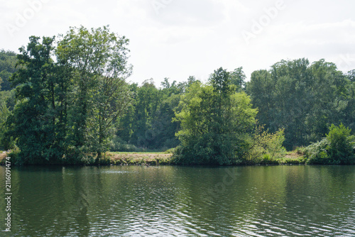 HERDECKE, GERMANY - JULY 25, 2026: Scenic landscape of Ruhr river with green forest on the opposite bank