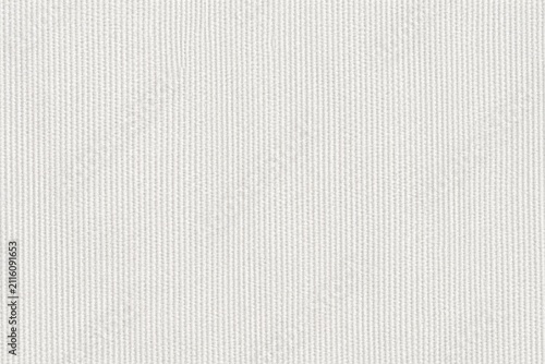 White fabric texture with fine vertical ribbing in soft diffused studio light for clean backgrounds