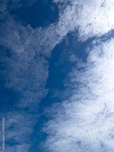Bild auf Leinwand White Cirrocumulus Clouds Against Blue Sky