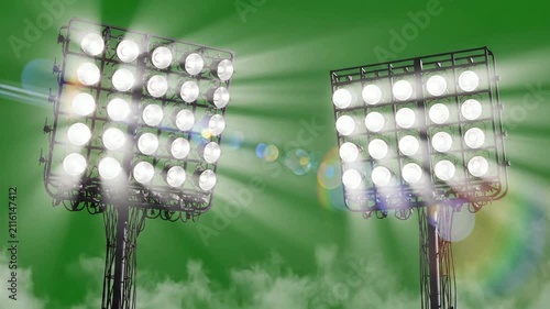 Stadium floodlights shining brightly against green background, with lens flare, and fog effect, for sports event atmosphere
