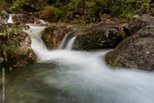 Fotografie Nature and environmental conservation, flowing river with waterfalls and rocks i