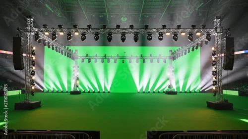 Concert stage with green screen background, and dynamic lighting, rig for virtual, production and event broadcasting