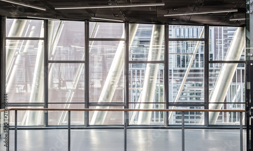 Abstract contemporary architecture or modern interior photograph. Geometric shapes and patterns formed by windows and railing on contemporary hallway.