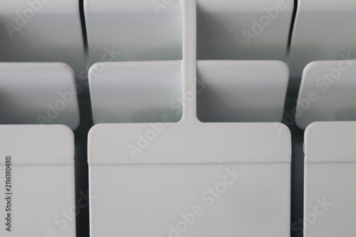 The top of the white aluminum radiator.