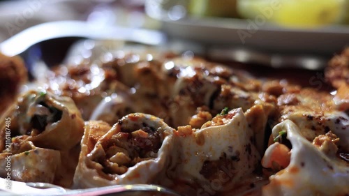 Close-up of traditional Turkish yogurt tantuni with melted butter sauce