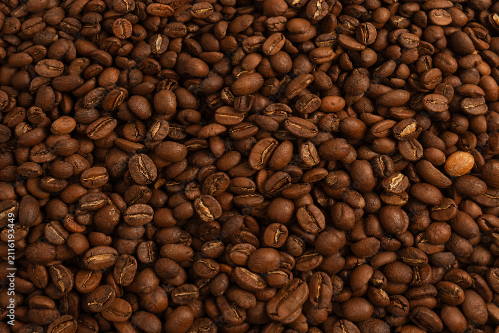 Obraz premium Coffee beans on a white background. Coffee beans texture.