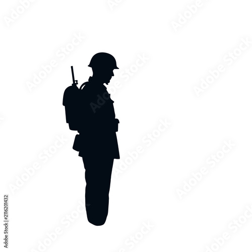 A dark silhouette of a standing soldier against a plain white background