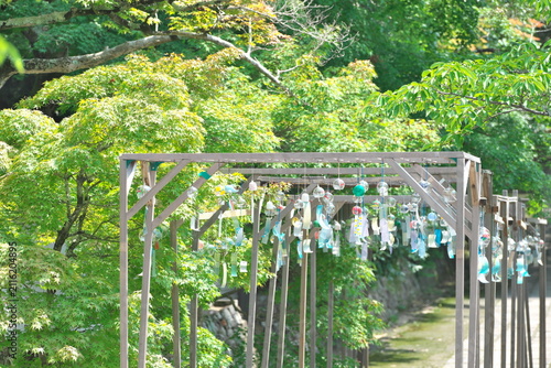 Japanese furin wind chimes hanging on wooden frame in summer