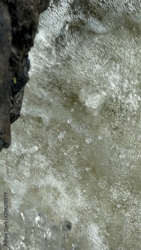 Dynamic Whitewater Splash with Droplets and Wet Rock