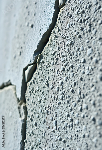 Cracked concrete wall textu...