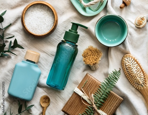 sustainable lifestyle flat lay with eco friendly everyday essentials in transformative teal and earth tone palette on natural linen