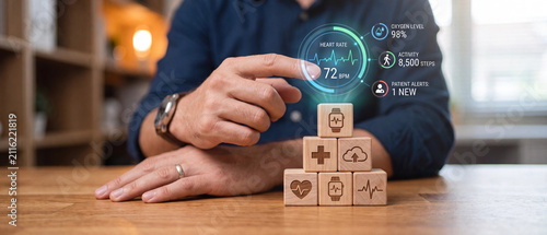 Healthcare technology concept with digital health interface and wooden blocks on desk