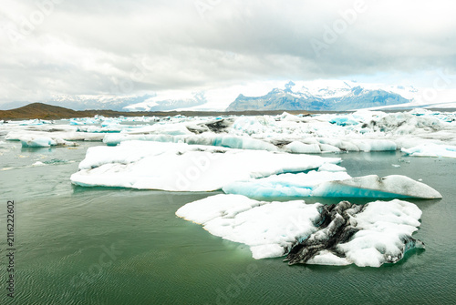 Floating icebergs in Jökulsárlón Glacier Lagoon Iceland with Vatnajökull glacier turquoise waters and breathtaking Arctic landscape