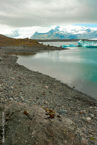 Floating icebergs in Jökulsárlón Glacier Lagoon Iceland with Vatnajökull glacier turquoise waters and breathtaking Arctic landscape