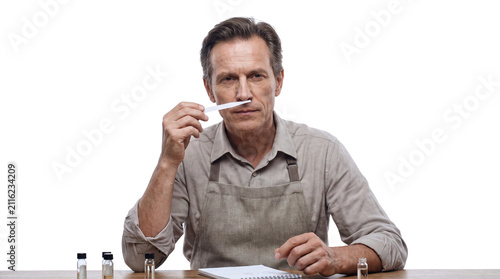 Professional Perfumer Smelling Fragrance Strip Tester Isolated on Transparent Background