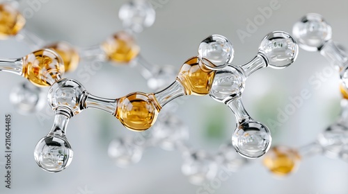 Glass model shows molecular structure with clear and amber spheres. Transparent tubes connect each sphere