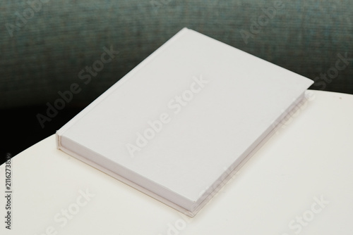 book mockup on coffee table soft light