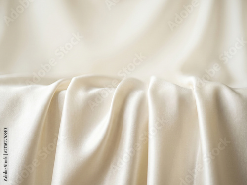 Cream Satin Stage Platform with Soft Flowing Draped Background for Product Showcase