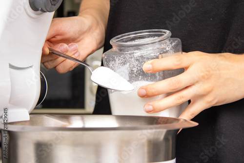 Foto Adding Sugar to Mixing Bowl for Cake Batter