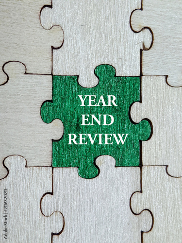 jigsaw puzzle piece. Key element in annual reflection with the year-end review connects past performance to future planning and growth. Business and education concept. Selective focus.
