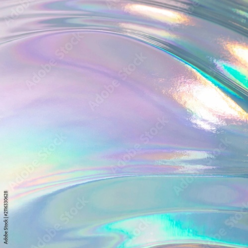 Vibrant holographic oil slick gradient backdrop featuring colorful reflections and distinctive patterns ideal for innovative design projects