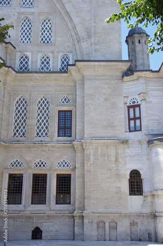 This image shows in detail the facade and exterior stone walls of the Nuruosmaniye Mosque, an 18th-century Ottoman mosque located in the Çemberlitaş neighborhood of the Fatih district of Istanbul, .