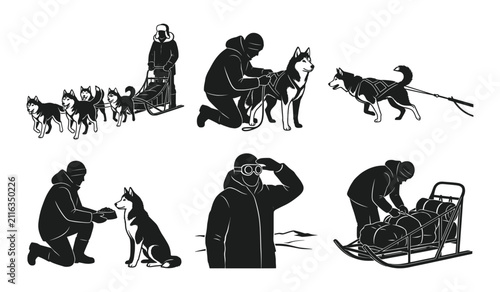 Person caring for sled dogs in winter gear
