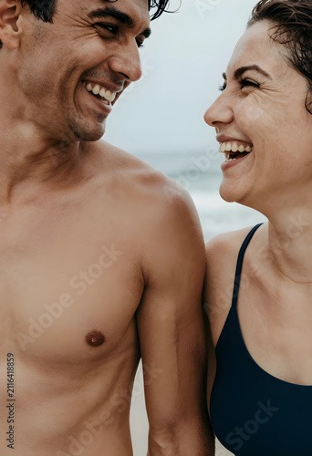 Happy couple laughing toget...