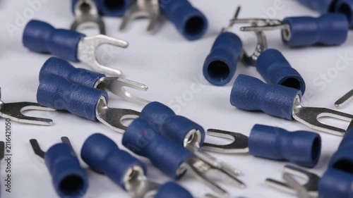 Metal tips with a plastic base for mounting on stranded copper wires. Close-up. Soft focus. Macro.
